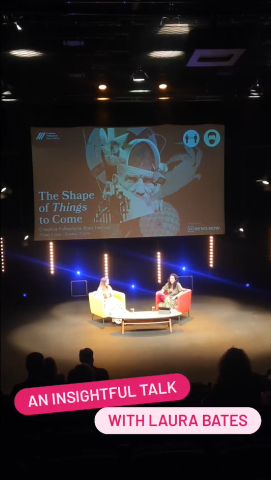 A view of two women on stage in an auditorium, under a screen saying 'The Shape of Things to Come'. A talk with author Laura Bates.