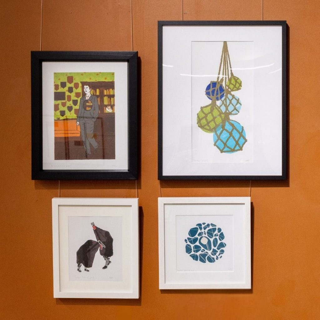 Four colourful, illustrative framed prints by Christie Grant.