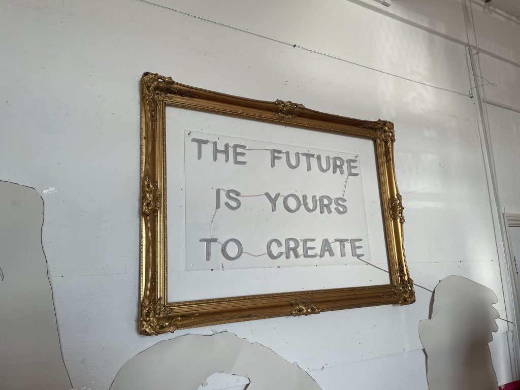 A piece of wall art that says The Future Is Yours To Create