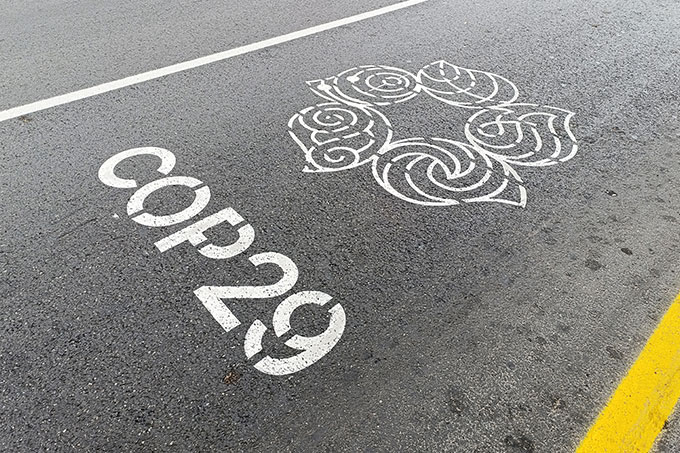 COP29 sign painted onto a road