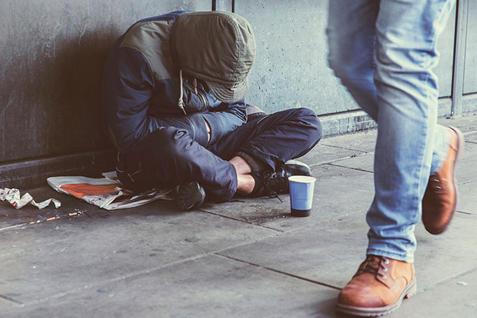 Rough sleeper begging on the street