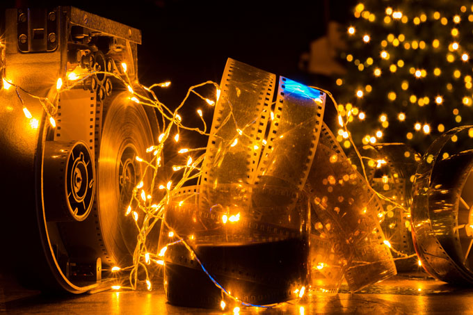 Filmstrip surrounded by Christmas lights