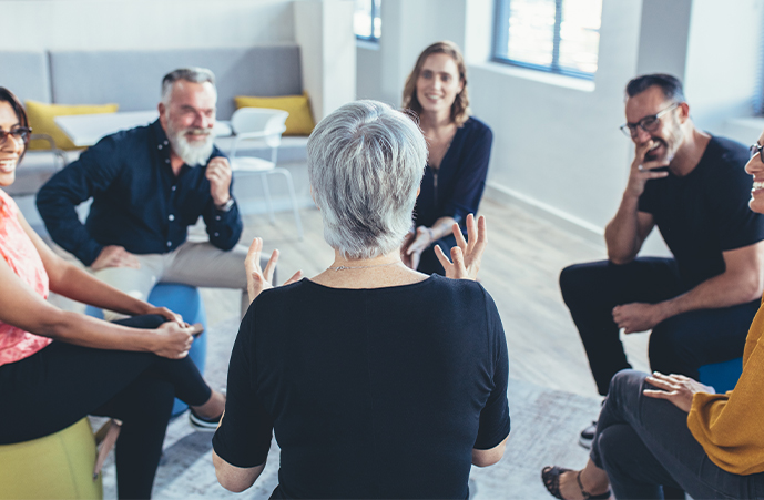 A group taking part in a sharing and listening exercise