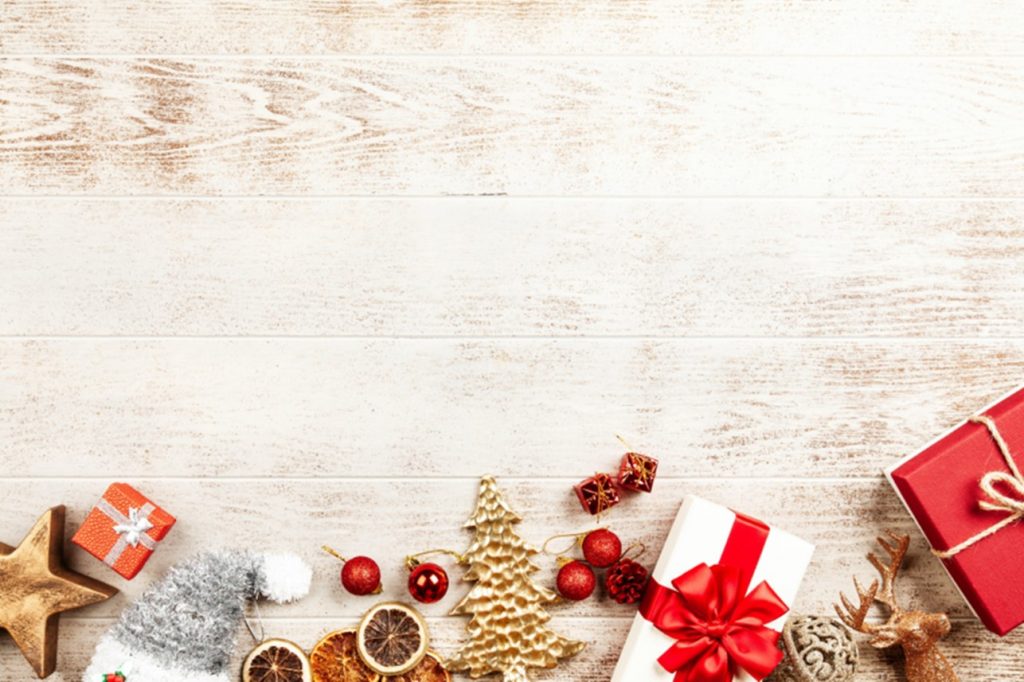 a table top with ornaments, presents and orange slices