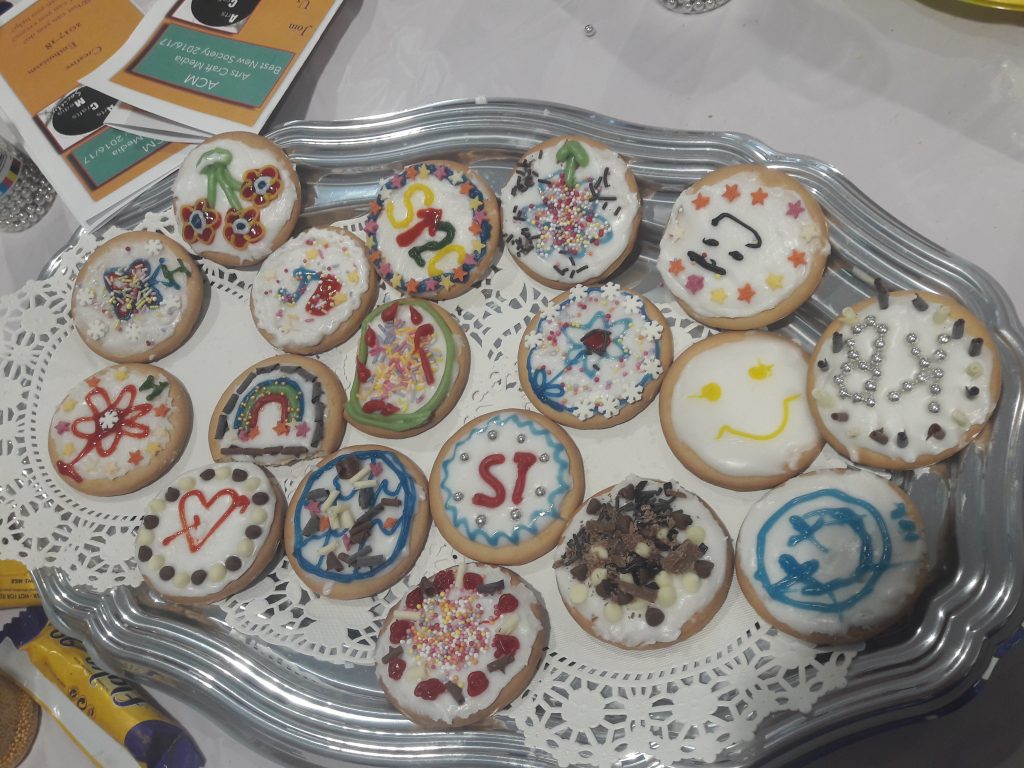 A tray displaying a range of biscuits decorated by students