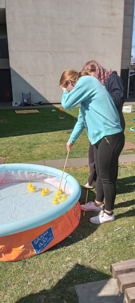 students playing hook the duck