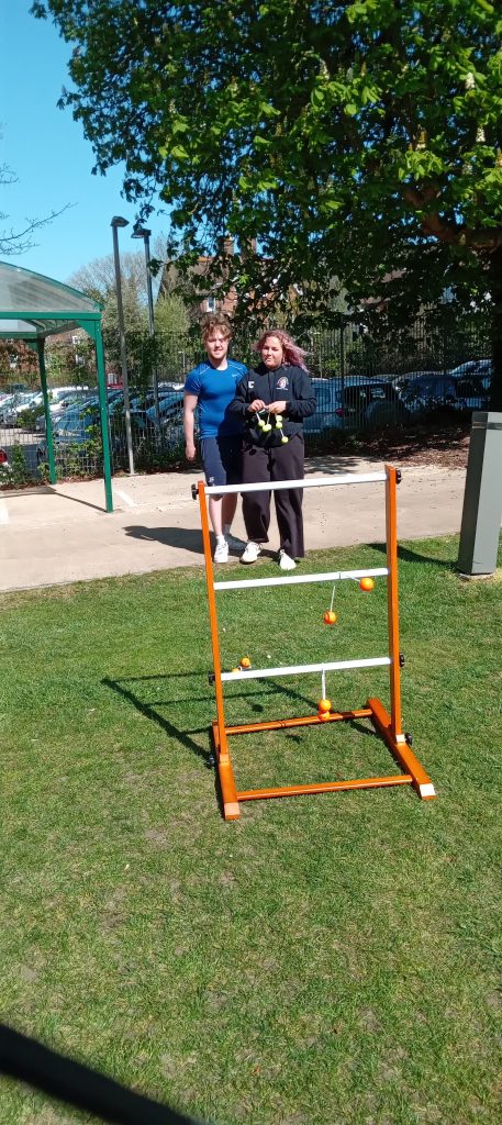 students playing ladder golf