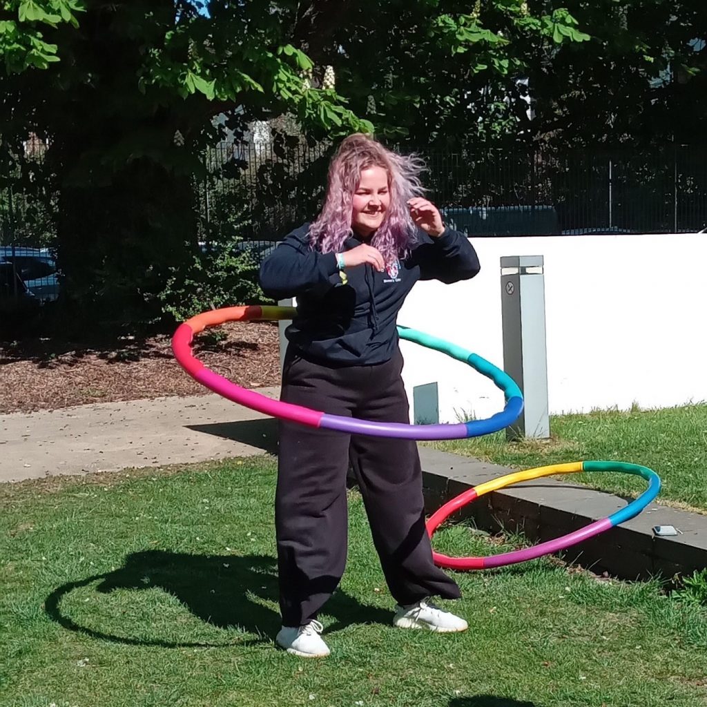 student with hula hoop