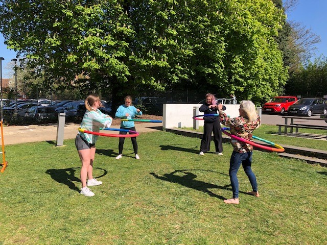 staff and students with hula hoops