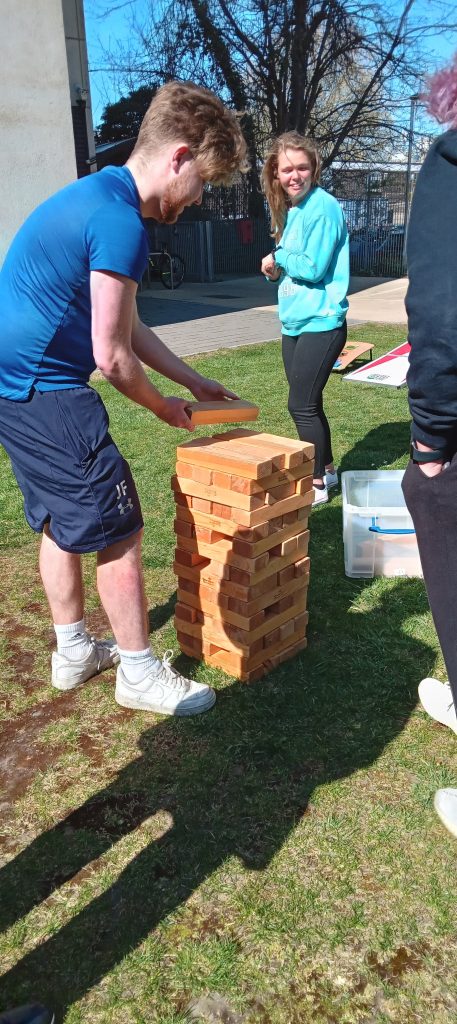 students playing giant jenga