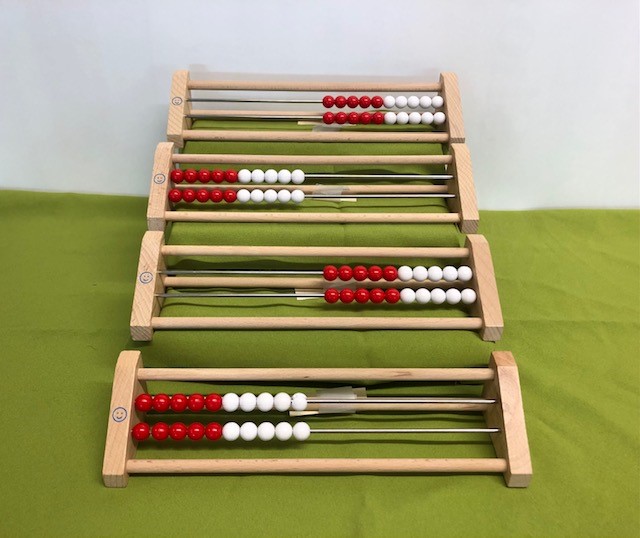 four wooden counting frames with two metal bars and twenty plastic balls