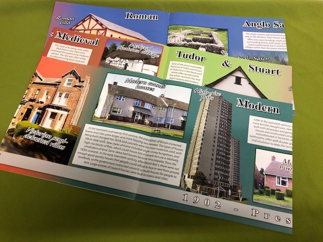 three wallcharts depicting homes from different time periods with images and blocks of descriptive text.