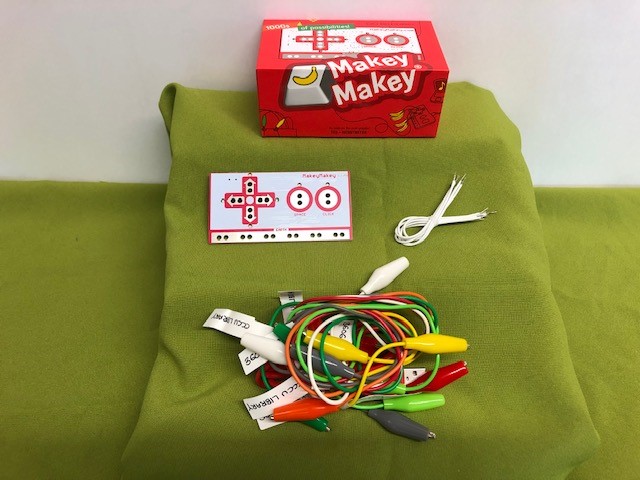 Makey Makey Classic box with control board, crocodile clips and wires.