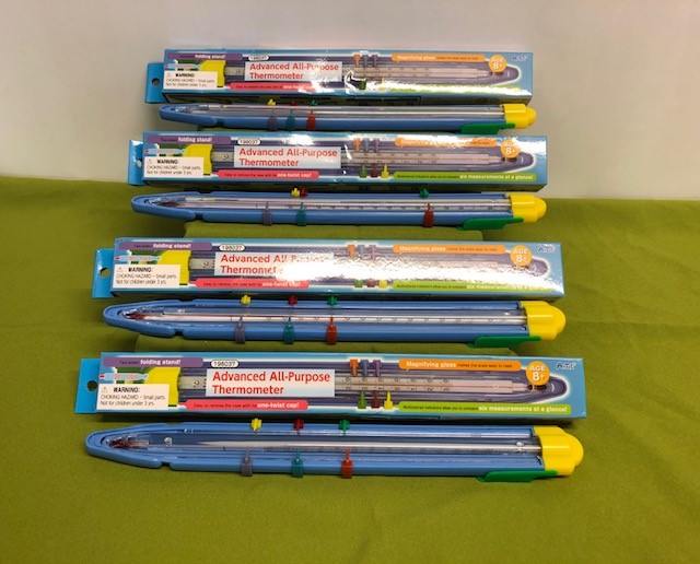 Ten large thermometers with adjustable recording points in boxes.