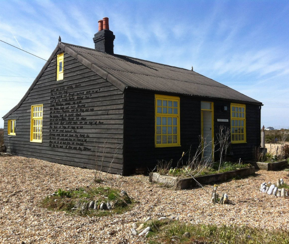 A photo of Prospect Cottage in Dungeness on a summery day with bright blue sky