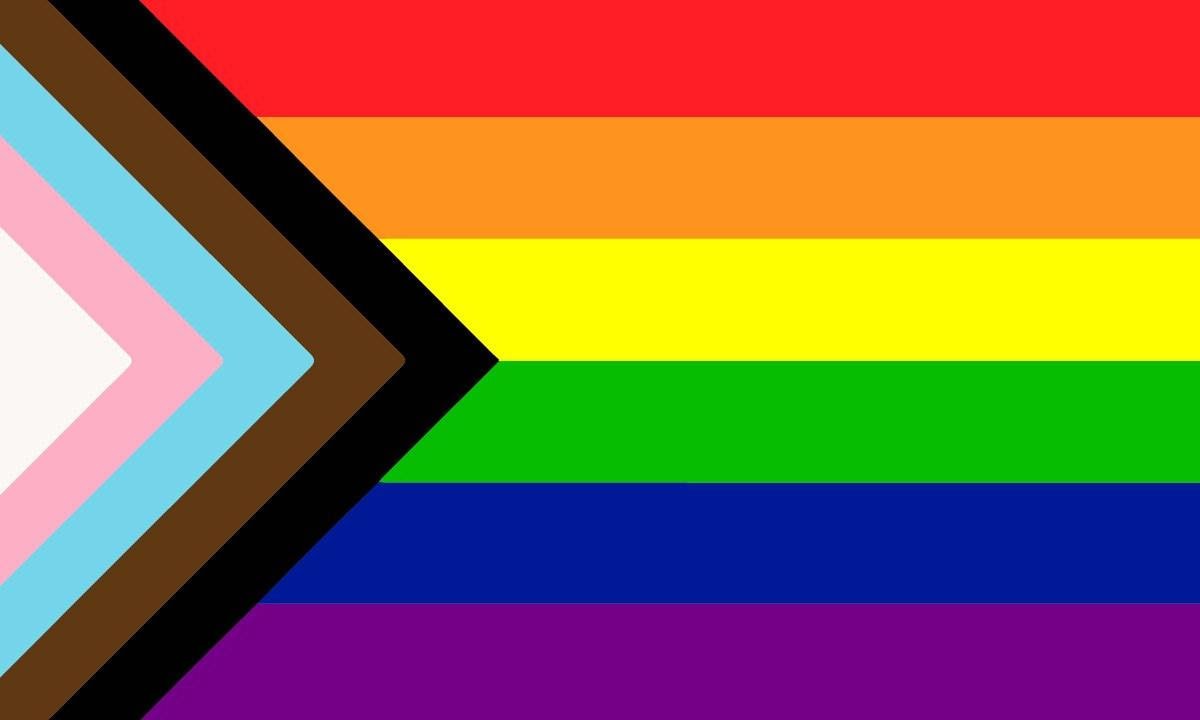 Pride flag - horizontal lines in the colour of the rainbox with chevrons on the left in the colours of white, pink, blue, brown and black from left to right.