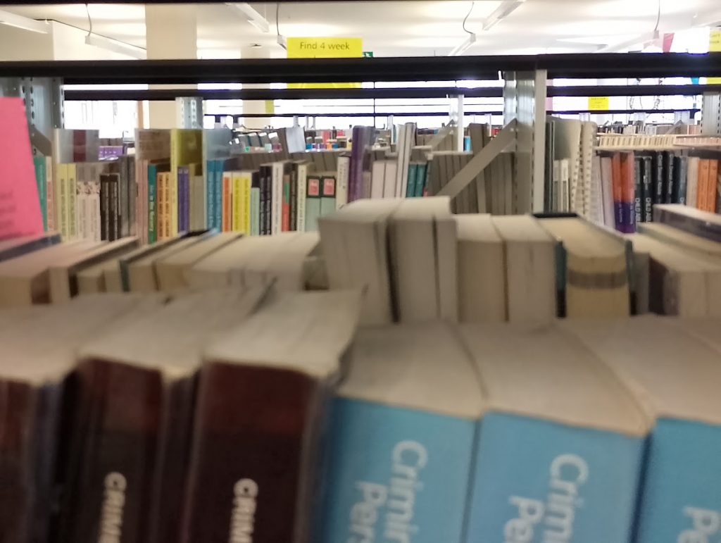 Photo of bookshelves in Augustine House Library.
Photo by V Mason