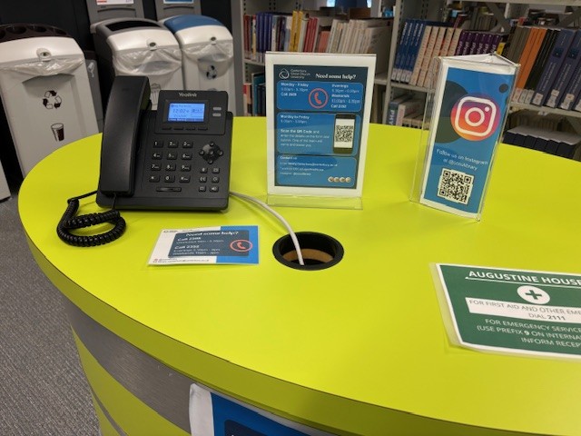 Help point with phone and QR code poster.