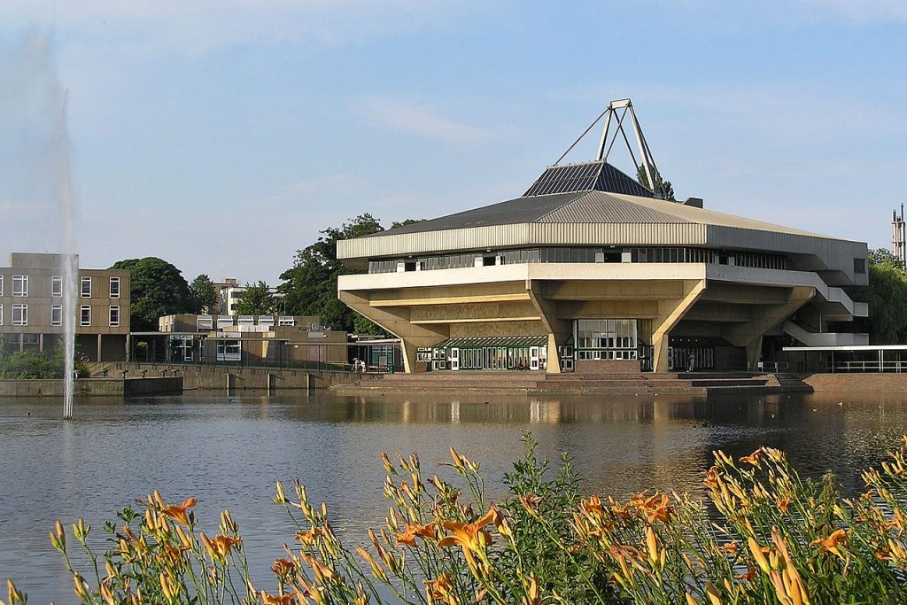 The University of York's Central Hall seen across the lake.