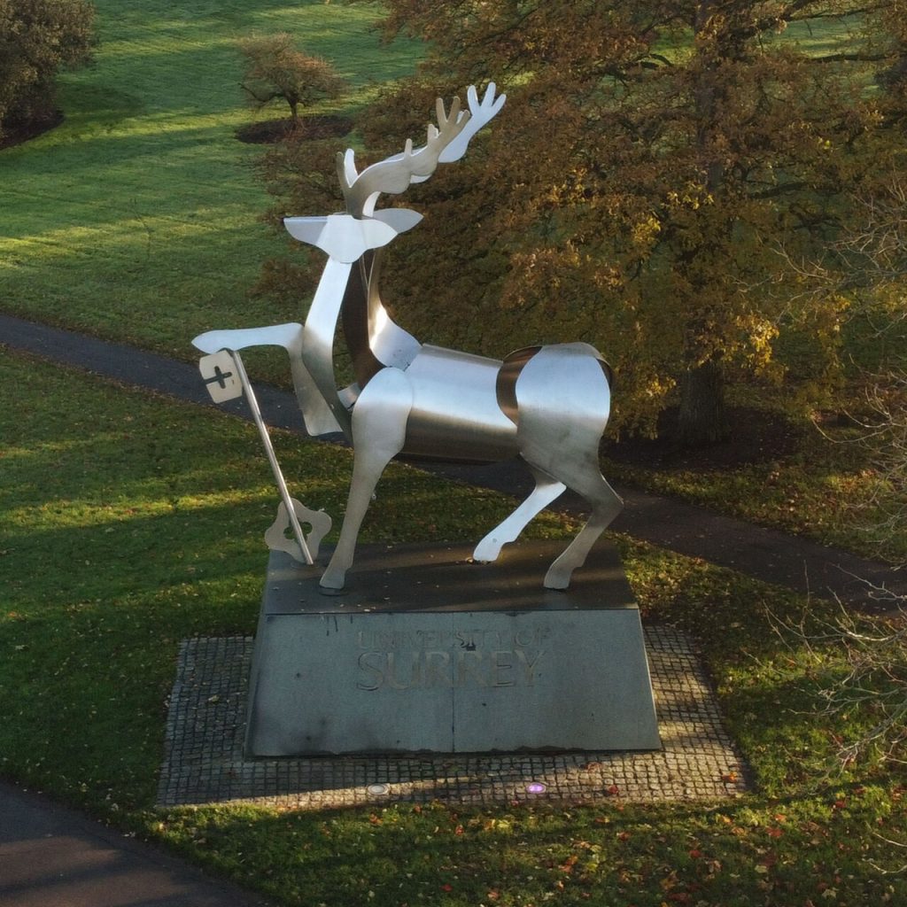 A metal statue of a stag on the University of Surrey's campus.