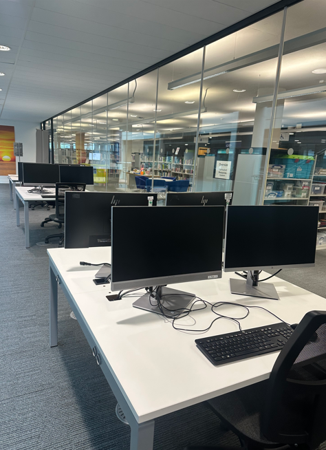 Desks and PCs located on the second floor atrium.