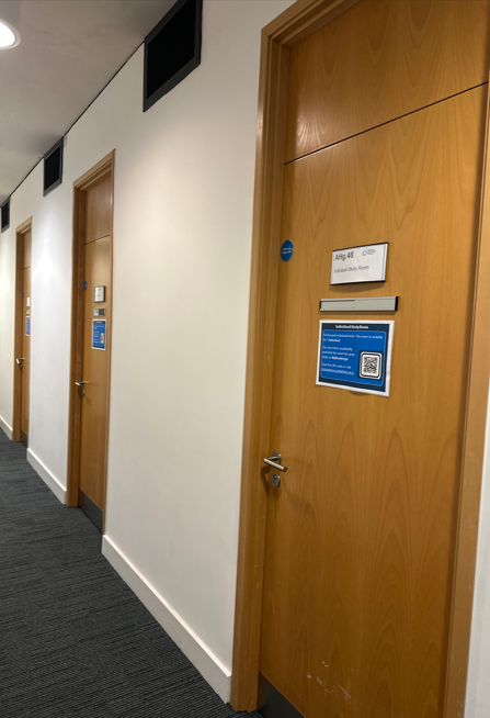 Photograph of the front of the doors of the three individual offices on Ground Floor.