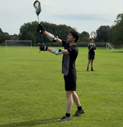 Homi playing Lacrosse