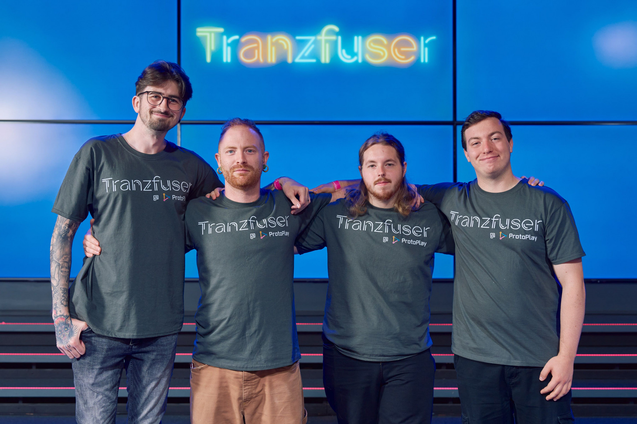 Photo of the four male alumni who are part of the winning team