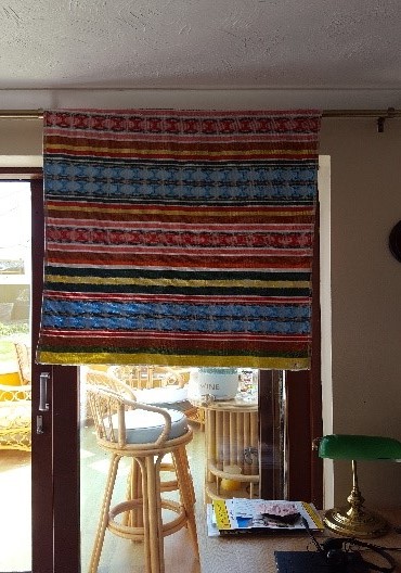 Beach Towel hung in window to block out glare