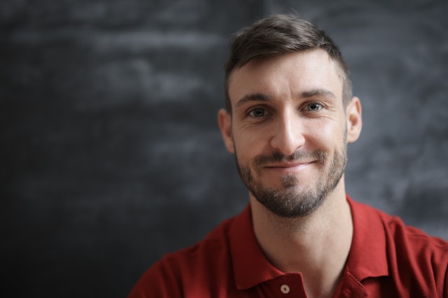 Man smiling at the camera. The exposure is at the correct level.