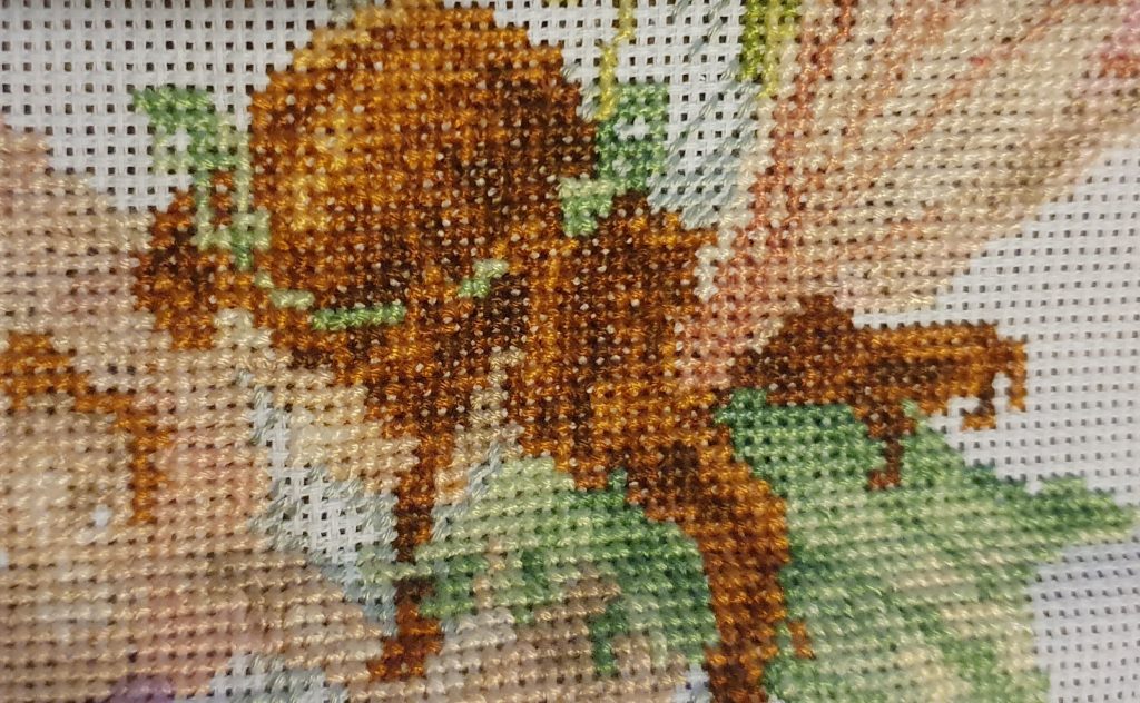 Cross stitch sample of a fairy.