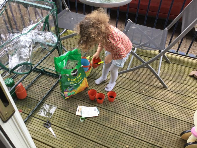 Mummy, daughter gardening 