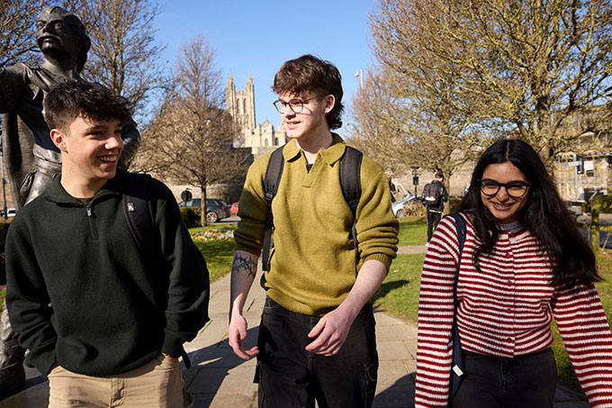 Three students walking in Canterbury