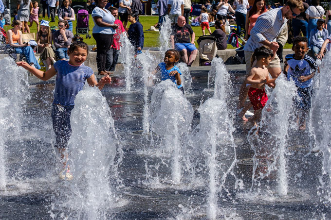 Children playing in a fountain