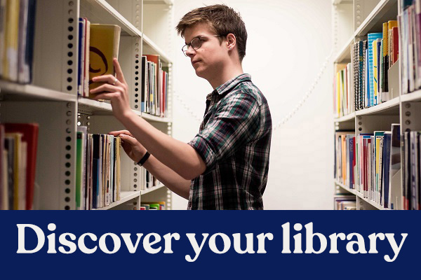 A student browsing the library shelves